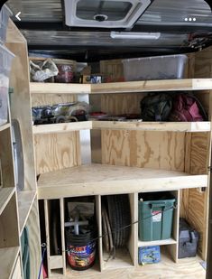 the inside of a truck with shelves and other items in it's storage area