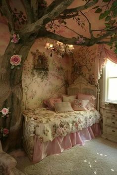 a bedroom decorated in pink and white with flowers on the walls, bedding and pillows