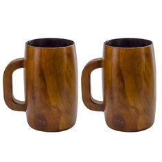 two wooden mugs sitting next to each other