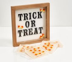 trick or treat candy candies in a wooden frame