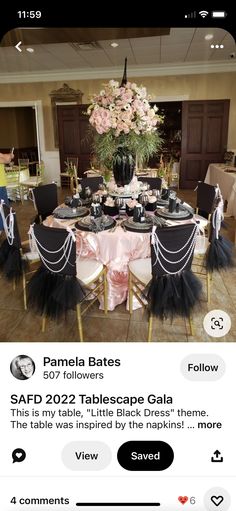 the table is set with black and pink decorations