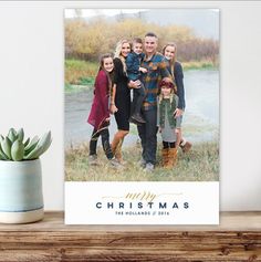 a family christmas card with the word merry on it