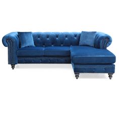 a blue sectional couch with pillows on the back and footrests, in front of a white background