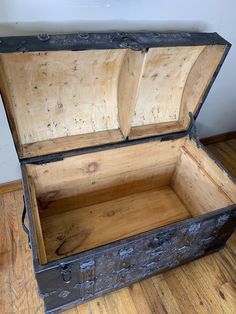 an old trunk is sitting on the floor