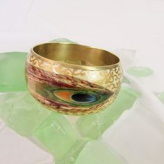 Brass enamel bangle bracelet Peacock design hand painted gold detail. Boho Retro Costume Jewelry Festive Peacock Design Bangle Bracelet, Peacock Design Bangle Bracelet Gift, Gold Bangle Bracelet With Peacock Design, Traditional Hand Painted Bangle Bracelet, Ceremonial Peacock Design Bangle Bracelet, Retro Costume, Boho Retro, Enamel Bangle, Peacock Design