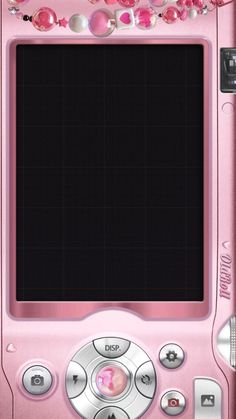 a pink cell phone with lots of buttons on the front and back side, sitting next to a string of beads