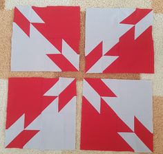 four red and white squares with arrows on them