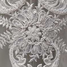 Our gorgeous Beaded & Corded Lace Fabric Embroidered on 100% Polyester Net Mesh will make you feel like a goddess on any special occasion. Whether you wear it for a wedding dress, evening gown, dance costume or a quinceanera dress, it will add a regal, luxurious touch. The embroidery with beaded & corded details will make your dress stand out and make you shine. Comes as 52" wide and in two colors, this soft, airy fabric will give a romantic look to your garment. We also offer two types of coutu Elegant White Embroidered Fabric For Celebrations, Elegant White Beaded Embroidered Fabric, Elegant White Embroidered Beaded Fabric, White Embellished Embroidered Fabric For Celebrations, White Beaded Embroidered Fabric For Festive Occasions, Dresses Dance, Wedding Dress Evening, Corded Lace Fabric, Dress Stand