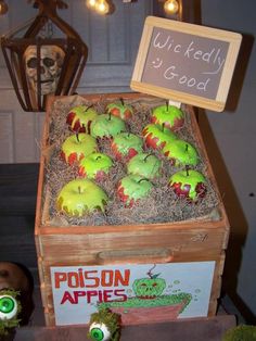 an apple box with apples in it and some fake green apples on the top, next to a sign that says uncle redly good