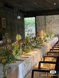 a long table is set up with flowers and candles for an elegant dinner or party