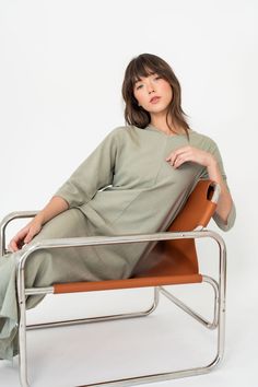 Embrace laid-back luxury with our Maxi V-neck Dolman Dress in Mint Green. Crafted from a linen blend fabric, it exudes a resort-worthy feel, perfect for leisurely days under the sun. The flowing silhouette and flattering V-neck design ensure both comfort and style, while the refreshing mint green hue adds a touch of serenity to your summer wardrobe. Upgrade your vacation vibes with this effortlessly chic ensemble. Dolman Dress, Wardrobe Upgrade, Vacation Vibes, Holiday Colors, Denim Shop, Summer Wardrobe, Neck Designs, Linen Blend, Mint Green