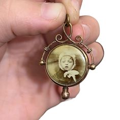 Circa 1900's Art Nouveau double sided photo medallion locket. A rare piece. Rose gold filled. Has original photos, one side of a child, the other of a woman. 1.6" inches long, 1.1" inches wide. The bottom nob unscrews to access the photos.  I have lots of other antique jewelry available. Please contact me for combined shipping. Antique Medallion Jewelry For Commemoration, Antique Commemoration Medallion Jewelry, Antique Finish Jewelry For Memorial, Antique Bronze Jewelry For Commemoration, Antique Cameo Necklace Keepsake, Antique Cameo Necklace As Keepsake, Antique Cameo Necklace For Keepsake, Victorian Round Locket Necklace, Victorian Jewelry With Antique Finish For Keepsake