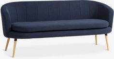 a blue couch with wooden legs and an upholstered back rest on a white background