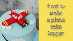 a blue cake with a red plane on it and the words how to make a plane cake topper