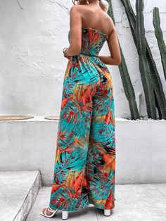 This Tropical Print Shirred Frill Trim Belted Tube Jumpsuit is the perfect addition to your wardrobe. It features a beautiful tropical print, eyelet embroidery, long sleeves, a stand collar, and a slim fit for a flattering silhouette. The fabric is made from a high-stretch polyester and elastane blend that moves with you as you go about your day. The belt adds an extra touch of style to this fashionable jumpsuit. Plus, it’s easy to care for—machine wash or professional dry clean when needed! Thi Tube Jumpsuit, Platform Heels Boots, Pink Chocolate, Black And White Baby, Eyelet Embroidery, Chunky Heel Pumps, Black Hot Pink, Boho Patterns, Platform Heels Chunky