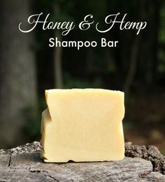 honey and hemp shampoo bar sitting on top of a piece of wood