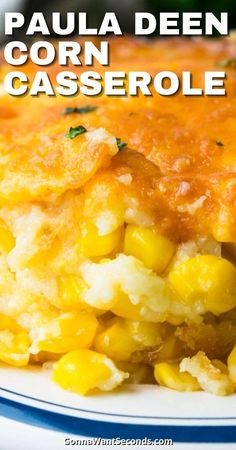 a close up of a casserole on a plate with the words, paula deen corn casserole