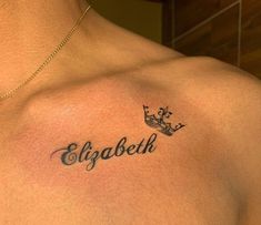 a man with a crown tattoo on his chest that says ellgobella