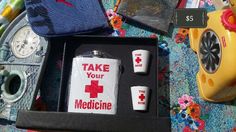 an assortment of medical items are laid out on a table with the contents labeled take your medicine