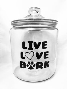 a glass jar with the words live love bark written on it