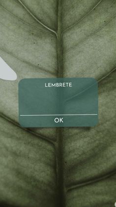 a close up of a green leaf with the words lemberete on it