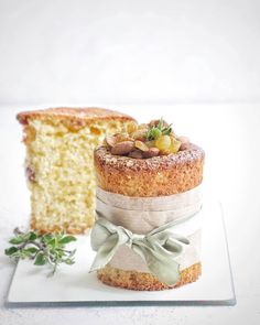 a piece of cake sitting on top of a plate next to a slice of cake