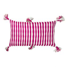 two red and white striped pillows with tassels