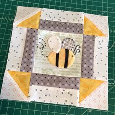 a patchwork piece with a bee on it