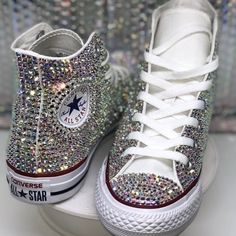 Custom Bling Converse Shoes Made By Bookerzbling Bottoms Of Shoes Could Be As Shown With Red And Blue Lines Or The All White Version If Your Size Isn't In Stock Anywhere Near Me :) (I Have 5 Stores I Go To) Regardless They Are High Top White Converse Shoes With Bling! Ab Rhinestones Are The Kind That Reflect Color Meaning The Bling Could Look Clear, Yellow, Pink, Silver, Green Etc. Depending On The Lighting And Sunshine! These Are Listed In Womens Sizing Even Though All Customs Are Made With Gre Rhinestones Converse, Bling Converse Shoes, Bedazzled Converse, Sparkly Converse, Rhinestone Converse, Bedazzled Shoes Diy, White Converse Shoes, Blue Quinceanera, Bedazzled Shoes