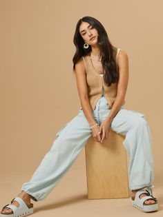 Elevate your casual ensemble with our baggy chambray cargo pants, a versatile piece for your everyday adventures. Featuring a tie waist and adjustable cinched ankles, these pants offer both comfort and style for effortless chic wherever you go. Light Wash Casual Cargo Bottoms, Light Wash Casual Cargo Style Bottoms, Casual Light Wash Cargo Bottoms, Casual Light Wash Cargo Style Bottoms, Light Wash Summer Utility Cargo Jeans, Summer Light Wash Utility Cargo Jeans, Summer Utility Style Light Wash Cargo Jeans, Light Wash Utility Cargo Jeans For Summer, Casual Light Wash Relaxed Fit Cargo Pants