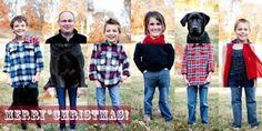 a group of people standing next to each other in front of a dog and the words merry christmas