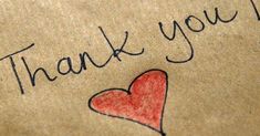 a thank you bag with a heart drawn on it