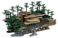 a lego model of a house surrounded by trees