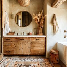 a bathroom with a large mirror and wooden cabinets