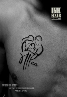 a tattoo on the chest of a man with an image of a woman holding a baby