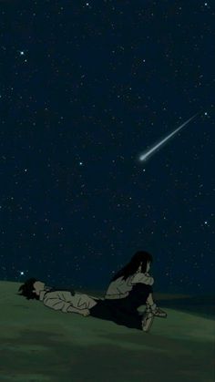 a person laying on the ground in front of a sky full of stars and a shooting star