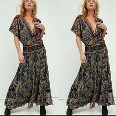 Forever Femme In A Floral Print, This Timeless Maxi Dress Is Featured In A Deep V-Neck, Absolutely Stunning Detail For All Occasions. - Dropped Waist Silhouette - Flutter Dolman Sleeves - Mirror-Embellished Detail Throughout For Added Dimension - Back Tie Detail - Front Tie Closure - Pleating On Skirt For Stylish Shape Care/Import Hand Wash Cold Import Contents Lining: 100% Modal 100% Modal 100% Poly Sleeve Len.: Approx 12" Bust: 40" Len: 58" Nwot/Boutique Size: 2 Retail: $298.00 Black Boho Print V-neck Dress, Black Bohemian V-neck Dress, Bohemian Fitted V-neck Maxi Dress, Black Boho Print Maxi Length Dress, Black V-neck Maxi Dress With Boho Print, Black V-neck Boho Dress With Print, Black V-neck Boho Dress With Boho Print, Black V-neck Boho Dress For Festival, Black Floral Maxi Dress For Festivals