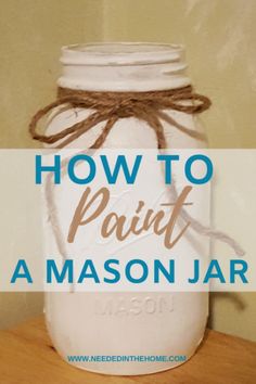 a mason jar with the words how to paint a mason jar on it and tied in twine