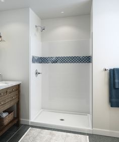 a bathroom with two sinks and a shower