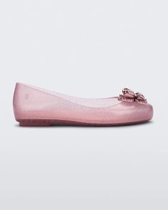 For mini fashionistas who love to play dress-up, the Sweet Love Butterfly is a feminine and delicate ballet flat with charming details, including a pearly shine effect on the upper and sole. The real standout is the double-butterfly appliqué on the vamp, which adds a touch of elegance to complete the look. The bottom butterfly has a rhinestone effect while the top one is smooth and metallic. Let your little one fly with Sweet Love. Pearly effect Ballet flat Butterfly appliqués Slide on/off Upper Punk Love, Melissa Sweet, Punk Movement, Love Butterfly, Kids Flats, Itzy Ritzy, Mini Melissa, Jelly Shoes, Quirky Design