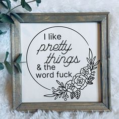 a framed sign with the words i like pretty things and the word fock on it