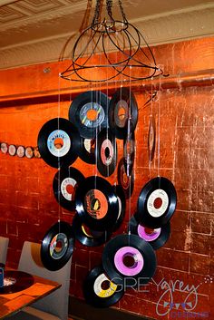 a chandelier made out of vinyl records hanging from the ceiling