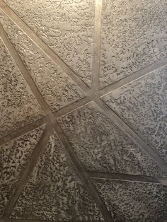 the ceiling is made up of many different shapes and sizes, including intersecting lines on it