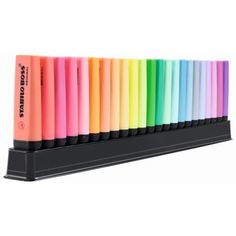 a row of multicolored pens sitting on top of a black stand