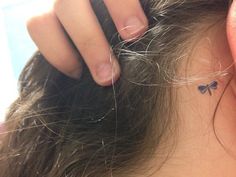 a woman is getting her hair done at the same time