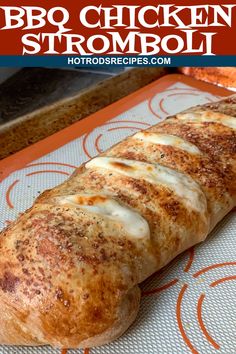 a close up of a bread on a tray with the words bbq chicken stromboli