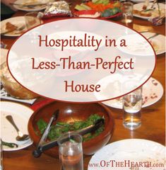 a wooden table topped with lots of plates and bowls filled with different types of food