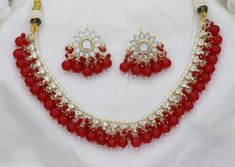 Red Beads Necklace Earrings Set/ Kundan Sleek Necklace Earrings Set, Designer Bridal Necklace Earrings, Indian Wedding Jewelry Set Kundan Necklace/Kundan Earrings/Beads Jewelry/Beads Necklace For the classy women out there 😍😍 ITEM DESCRIPTION Metal = Gold Plated Occasion = Wedding, Party Wear, Bridal Color = Hot Pink and Gold Necklace Size = 16 CM Earring Size = 3 CM Designer Latest Kundan Necklace Earrings Set Free Shipping Red Beaded Jewelry For Anniversary, Red Beaded Kundan Necklace For Wedding, Red Dangling Beads Jewelry For Wedding, Red Wedding Jewelry With Dangling Beads, Red Kundan Necklace With Round Beads For Party, Red Jewelry For Anniversary And Festive Occasions, Red Festive Jewelry For Anniversary, Red Kundan Necklace For Party, Red Beads Necklace