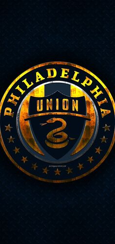 the philadelphia union logo is shown in gold and black on a dark background with stars