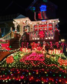 a house covered in christmas lights and decorations